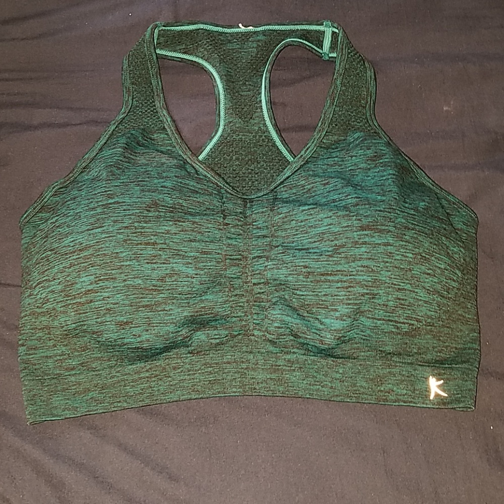 Sports bra. Never worn! Has removable pads.